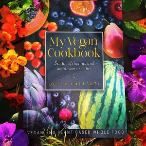 A cookbook with an array of flowers and herbs.