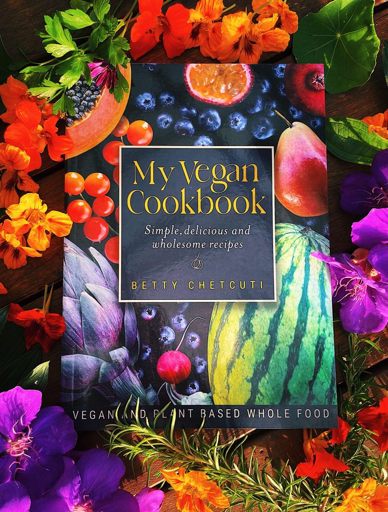 A cookbook with an array of flowers and herbs.